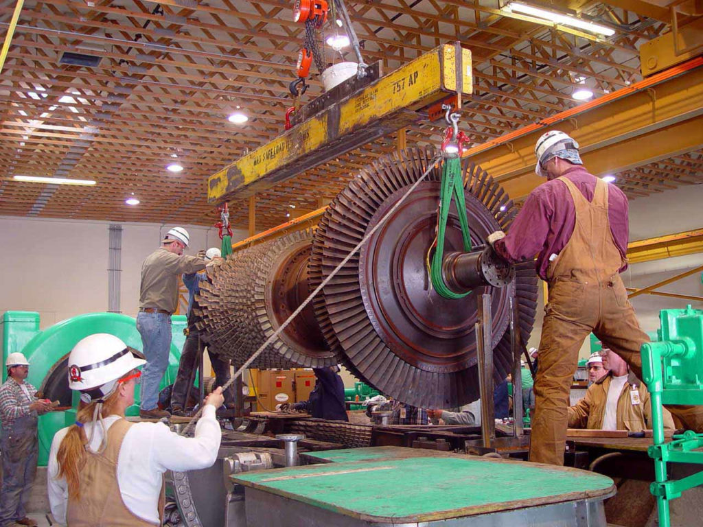 UBC millwrights lifting a heavy turbine