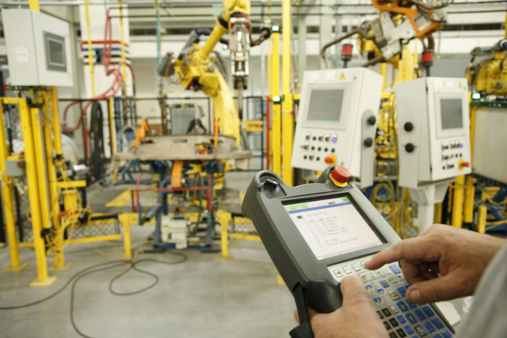 UBC millwright calibrating industrial equipment