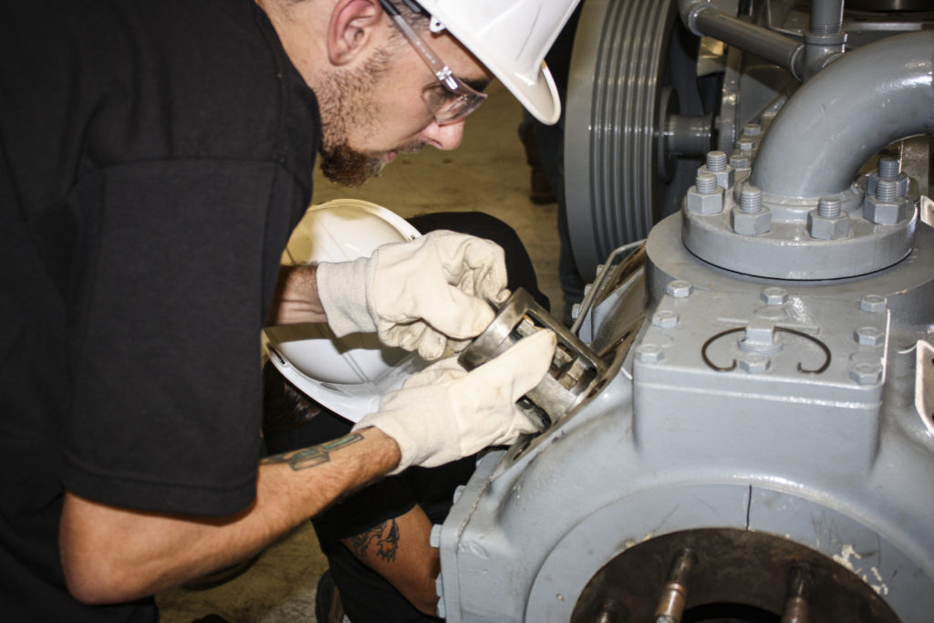 UBC millwrights assembling an industrial turbine